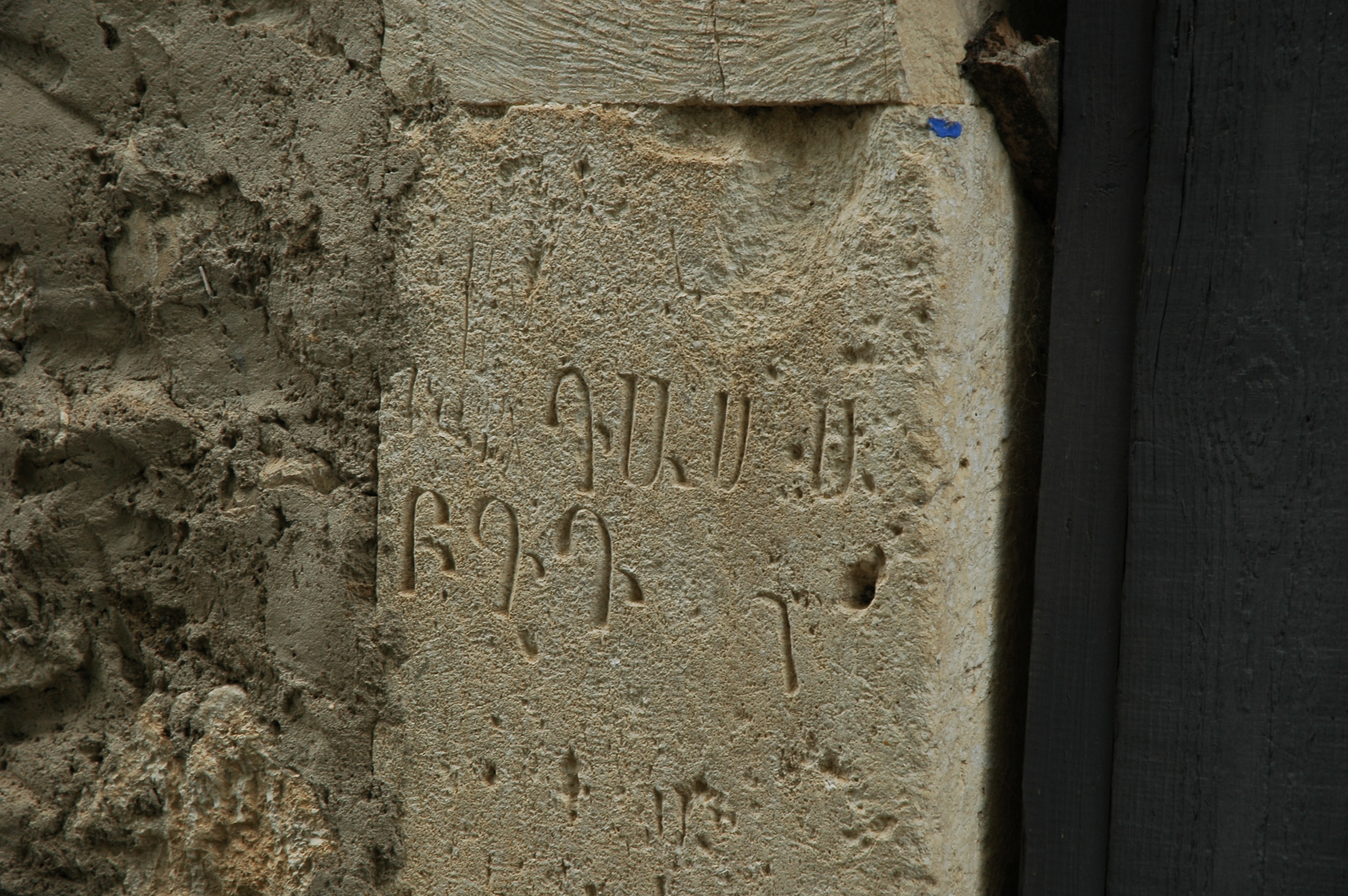 The first letters of Armenian alphabet on the monastery wall. 