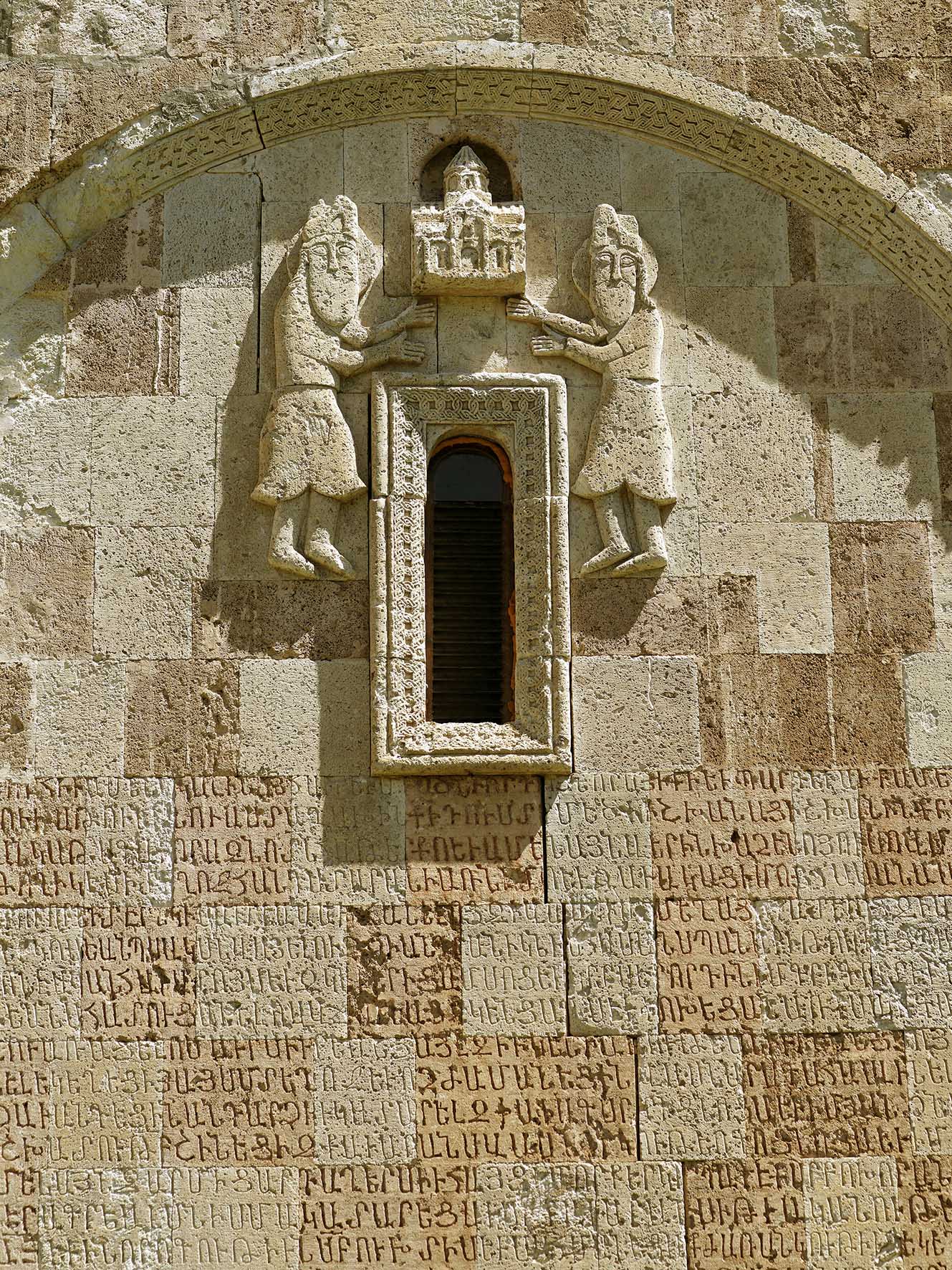 Dadivankʻ monastery, Artsʻakh. Main church (Katʻoghikē), 1214. Top of the south façade. Probably, the two deceased sons of the sponsor. Photo: H.H. Khatcherian